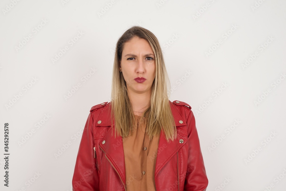 Portrait of outraged young woman with oval face, frowning her eyebrows being displeased with something. Portrait of outraged young woman with oval face, frowning her eyebrows being displeased with something.