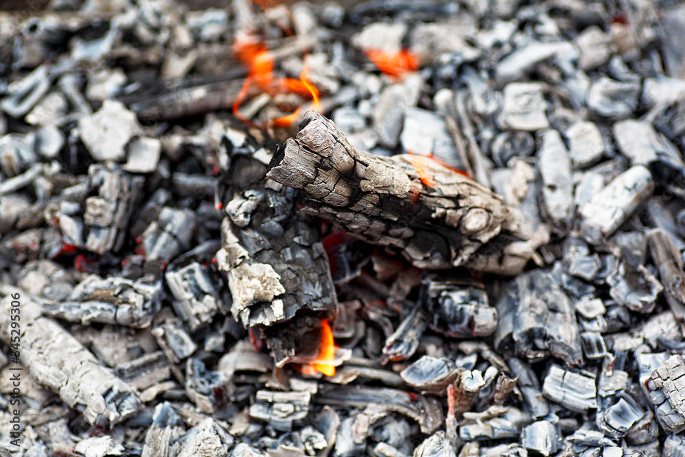 Texture embers closeup. Embers after a fire. Details of charcoal for barbecue at picnic. Texture embers closeup. Embers after a fire. Details of charcoal for barbecue at picnic.
