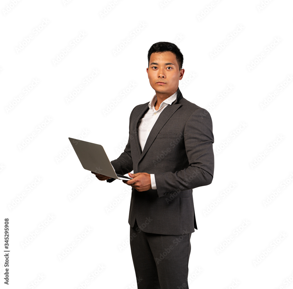 Serious Asian businessman with laptop, isolated