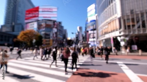 Wallpaper Mural Blurred and unrecognizable people crossing the street at Shibuya intersection in the morning.	 Torontodigital.ca