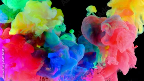 Color paint drops in water , abstract color mix , drop of Ink color mix paint falling on water Colorful ink in water, 4K footage,
 photo