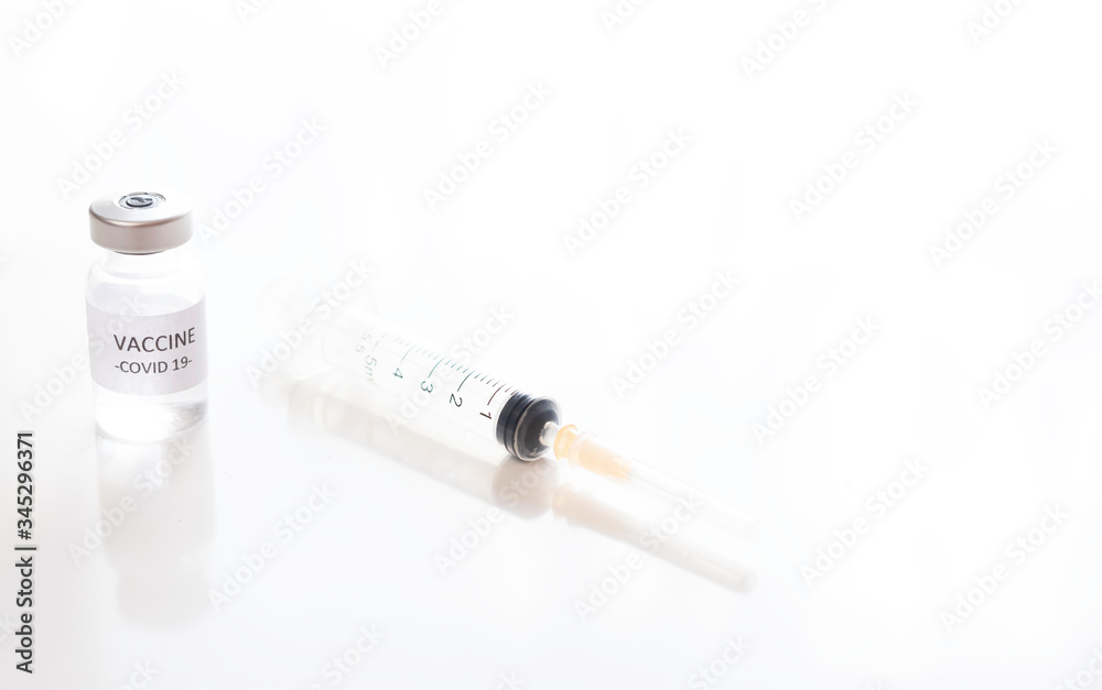 COVID-19 coronavirus vaccine. Vaccine and syringe for Sars-CoV-2 virus in research.Copy space.Concept medicine. COVID-19 coronavirus vaccine. Vaccine and syringe for Sars-CoV-2 virus in research.Copy space.Concept medicine.