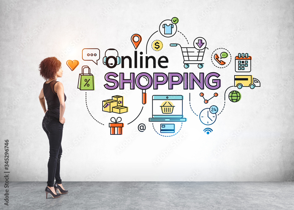 African woman looking at online shopping icons African woman looking at online shopping icons