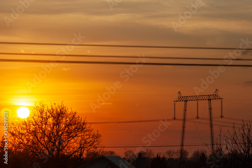 Circle orange sun with clouds background. Landstape in Poland. photo