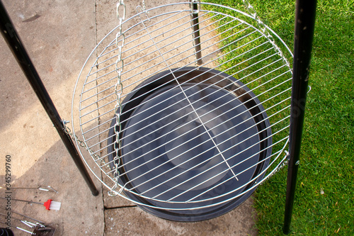 Empty clean and new grill grate. Round chrome steel for cooking.