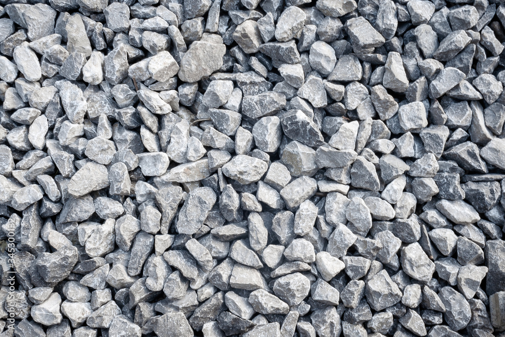 Top view of gravel texture. Small road with grey pebble. Abstract background. Top view of gravel texture. Small road with grey pebble. Abstract background.