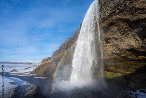 Seljalandsfoss Water on the south coast of Iceland. Blue skies refracting sunlight.
