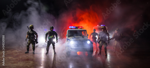 Police cars at night. Police car chasing a car at night with fog background. 911 Emergency response police car speeding to scene of crime. Selective focus