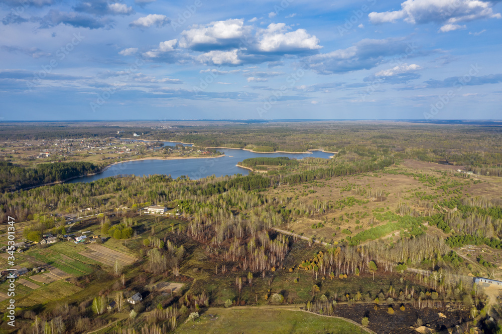 Aerial landscape. Beautiful nature, colorful forest and water reservoir. Teteriv River. Ukraine, Zhytomyr region, near Denyshi