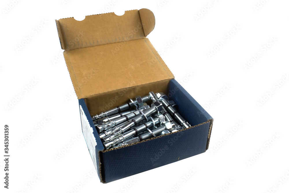 Construction fastening, wedge galvanized anchor in a cardboard carob, isolate on white . Construction fastening, wedge galvanized anchor in a cardboard carob, isolate on white .