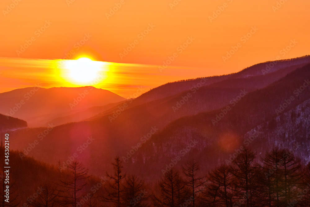 Sunset among the mountains on the road Lidoga-Vanino Khabarovsk territory.