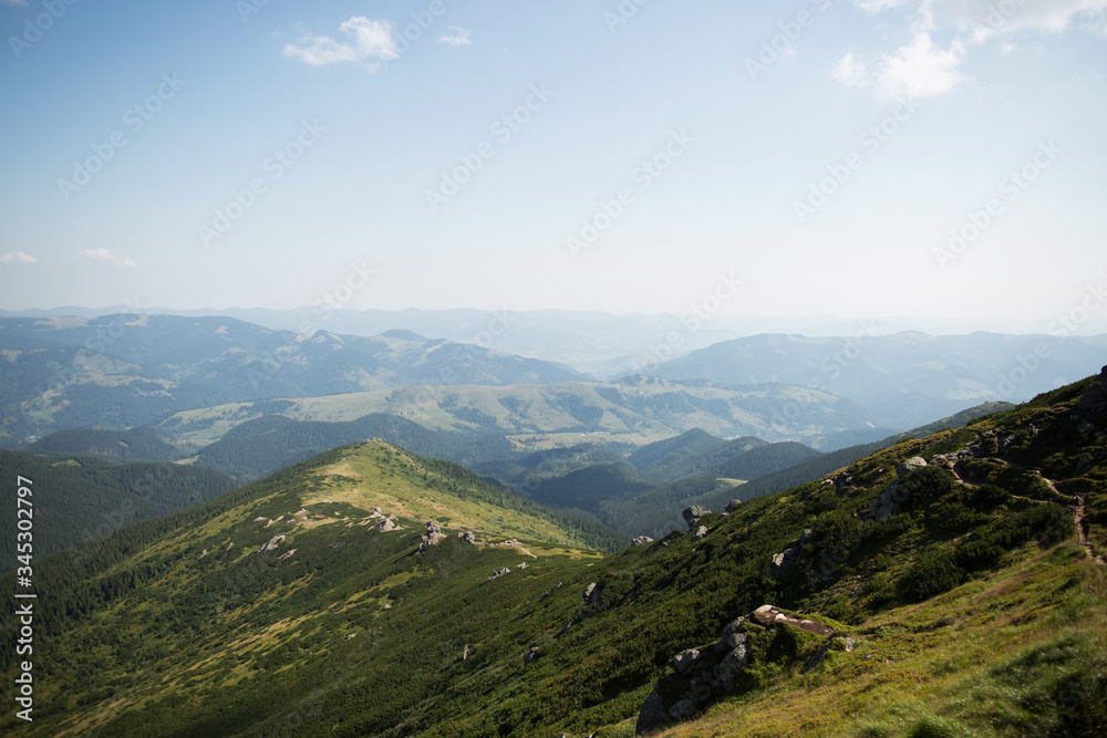 Naklejka premium Beautiful landscape of green hills and mountains. Travel concept. Carpathian mountains