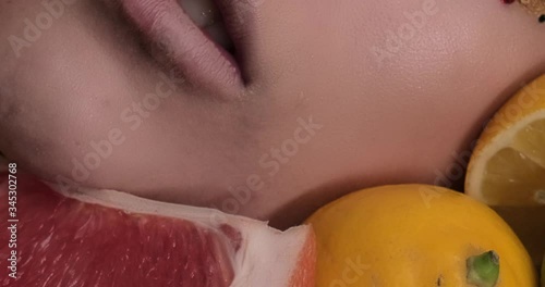 Wallpaper Mural Beautiful girl with slices lemon as neck less.Portrait of a woman with oranges as a accessories. Fashion model with creative food vegetable make-up .Sensual woman with luxury makeup and hair style Torontodigital.ca