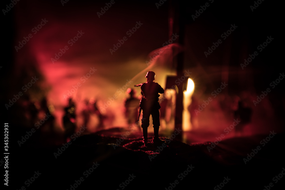 Fototapeta premium War Concept. Military silhouettes fighting scene on war fog sky background, World War Soldiers Silhouette Below Cloudy Skyline At night.