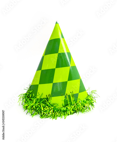 Green party cap made of paper, isolated on white background. Holiday cup, carnival accessory with tinsel.