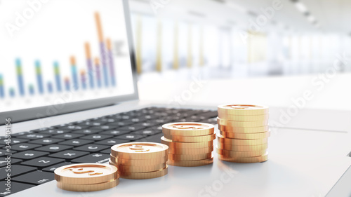 Four stacked gold coins placed on the laptop.3D rendering.