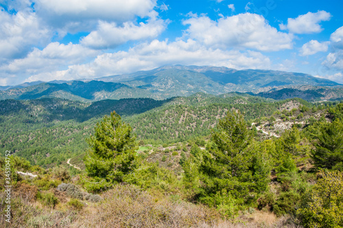 Light clouds cast fancy shadows on the peaks and slopes of the Troodos Mountains. Shadows creep from mountain to mountain, changing their shape.          © Andrey