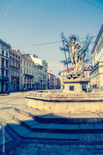 Neptune Monument in Lviv. Central Market Square in Lviv. photo