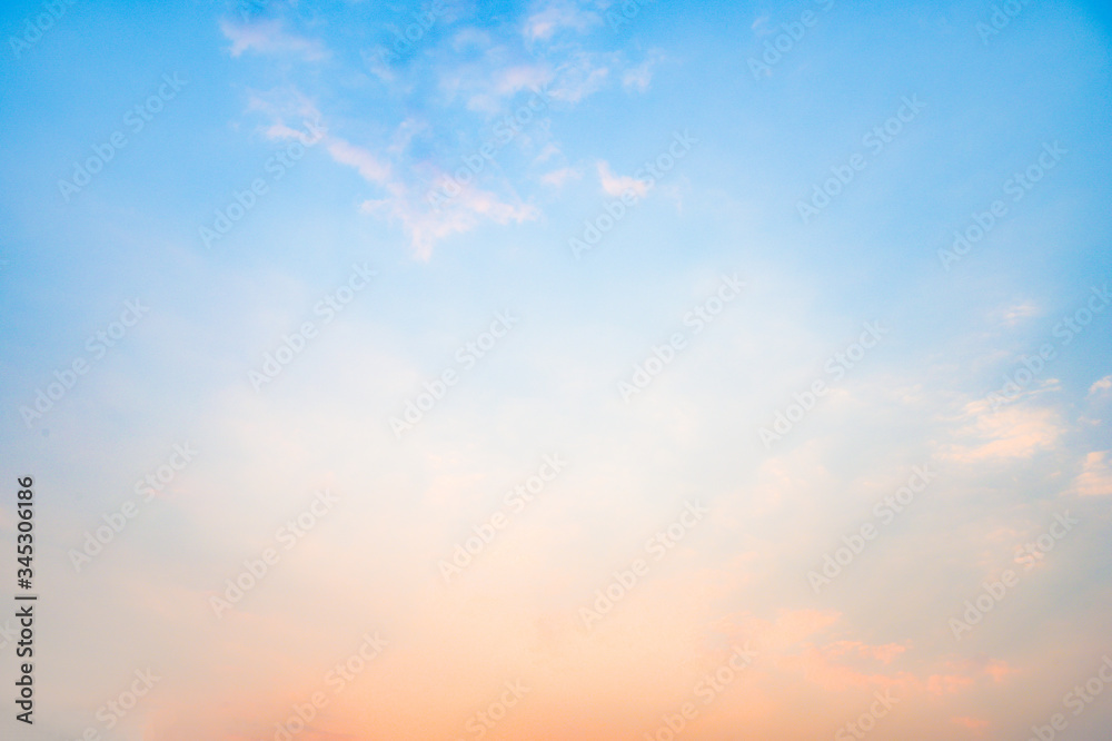 Beautiful sky with cloud before sunset. Colorful sky in twilight background. Bright Blue, Orange And Yellow Colors Sunset.