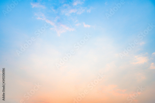 Beautiful sky with cloud before sunset. Colorful sky in twilight background. Bright Blue, Orange And Yellow Colors Sunset. © surattana