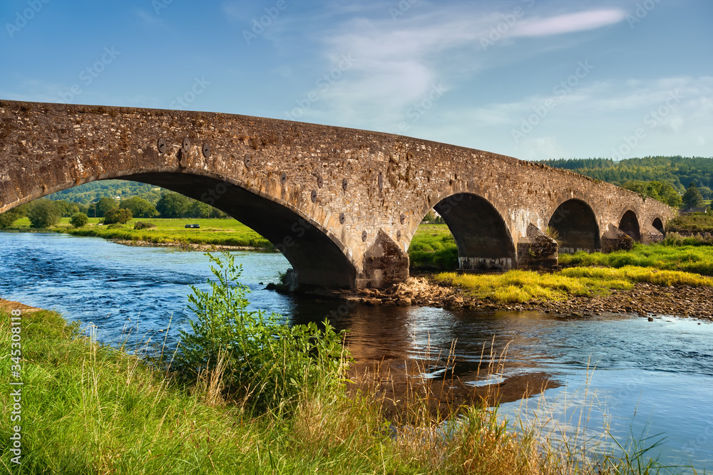 Old Arch Bridge On Suir River In Ireland