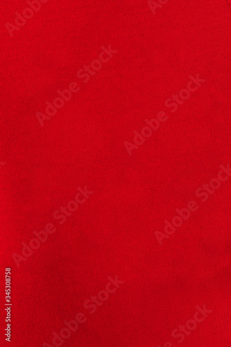 Abstract red fabric texture background. Creases of red color cotton.