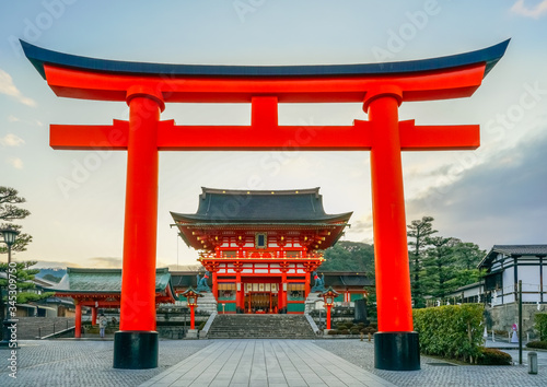Fushimi Inari Shrine  at sunrise, Kyoto, Japan. The japanese on the building means Fushimi Inari Shrine. 