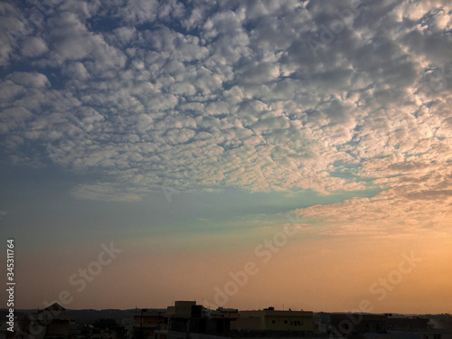 A BEAUTIFUL EVENING SKY WITH BRIGHT AND CHARMING CLOUDS IN THE SKY