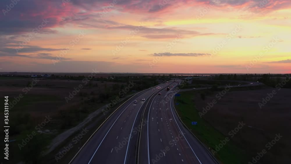 Road junction at sunset from above, highway in the steppe Road junction at sunset from above, highway in the steppe