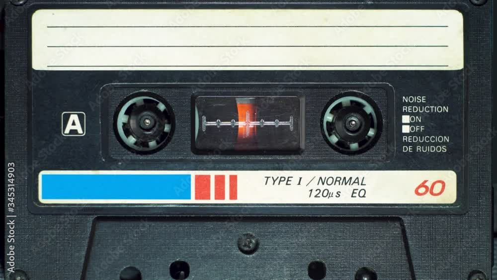 vintage audio cassette plays in tape deck