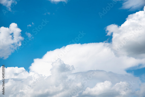 Beautiful blue sky and close-up white clouds. Nature background.