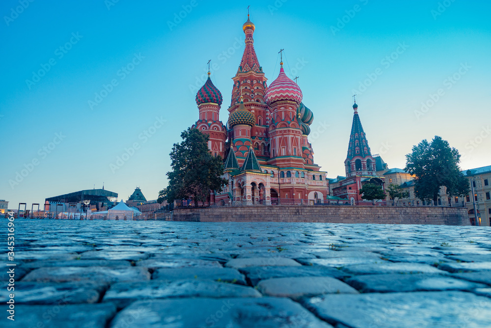 Moscow. Russia. St. Basil's Cathedral view from below. Red Square in Moscow. Big cathedral near the Kremlin. St. Basil's Cathedral on the background of blue sky. Churches of Russia. Paving stones.