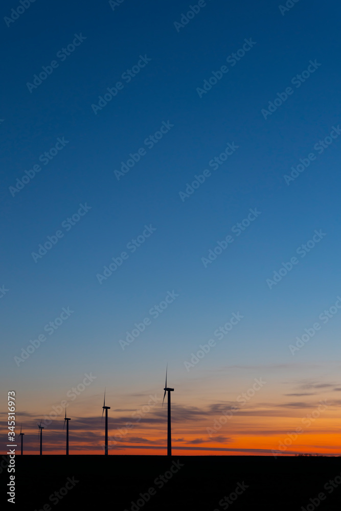 Fototapeta premium Wind turbines during sunrise, Southern Moravia, Czech Republic