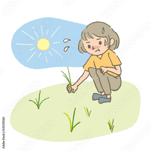 夏に草取りをする女性