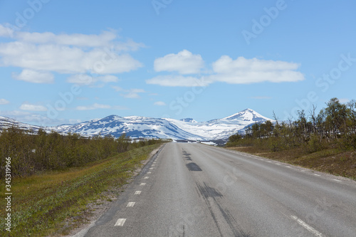 road passing in a valley between mountains in Sweden, selective focus