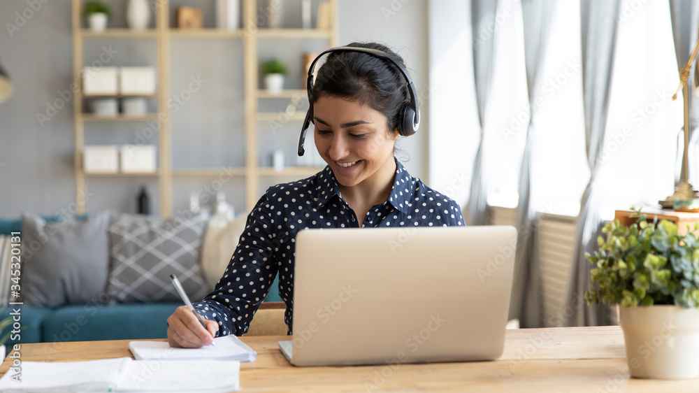 Head ahot happy indian girl student wearing headphones, watching ...