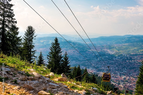 View from the top of the mountain on the city of Sarajevo and funiculars rising up to the highest point of the city.