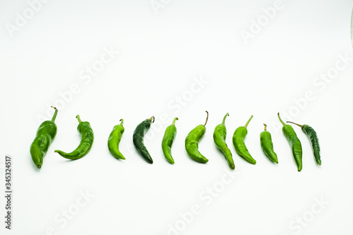 Green Chili or peppers or Capsicums , shots on isolated white background.
