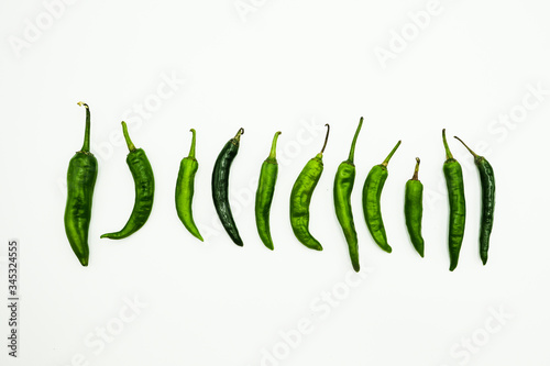Green Chili or peppers or Capsicums , shots on isolated white background.