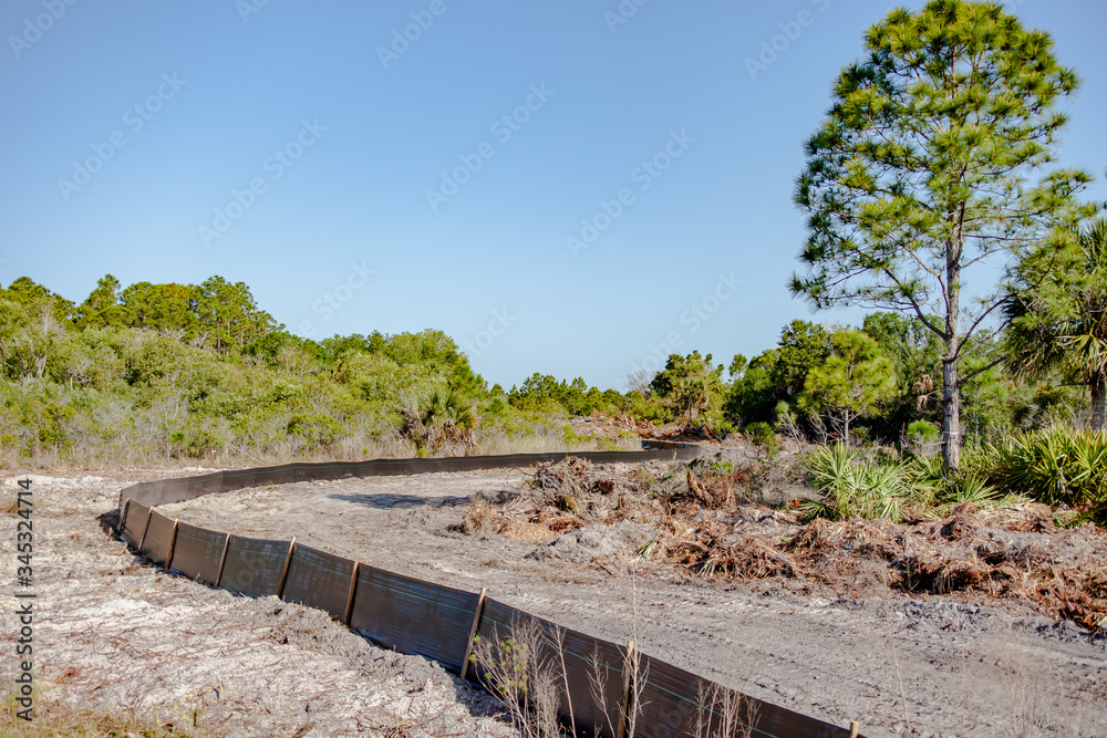 A pasture in southwest Florida is prepared to become a new housing subdivision. A pasture in southwest Florida is prepared to become a new housing subdivision.
