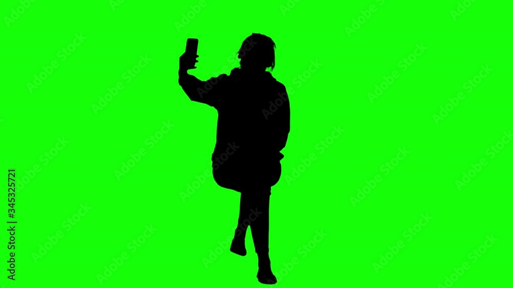 Girl Takes a Selfie While Sitting Green Screen Silhouette Girl Takes a Selfie While Sitting Green Screen Silhouette