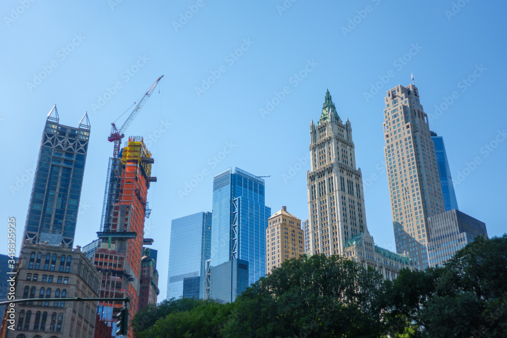 City district with skyscrapers against blue sky
