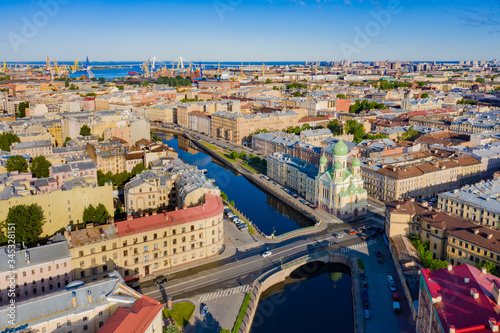 Saint Petersburg from a height. Russia. Panorama of St. Petersburg on a Sunny summer day. St. Isidore's Church. Orthodox Church on the Griboyedov canal. Churches Of St. Petersburg. Mogilev bridge.