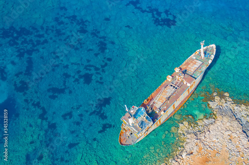 Shipwreck in Cyprus. Pathos. White stones. The ship ran aground view from above. The ship crashed on the coastal rocks. Abandoned sea vessels. View of the shipwreck from a drone. Sights Of Cyprus. © Grispb