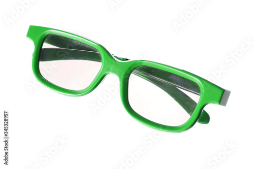 Folded green childrens glasses for 3D films isolated on white background