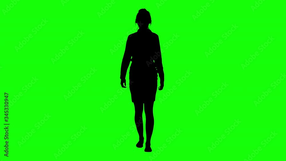Front View of an Elegant Businesswoman Walking Green Screen Silhouette