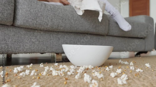 Popcorn plate falling on a floor in slow motion
