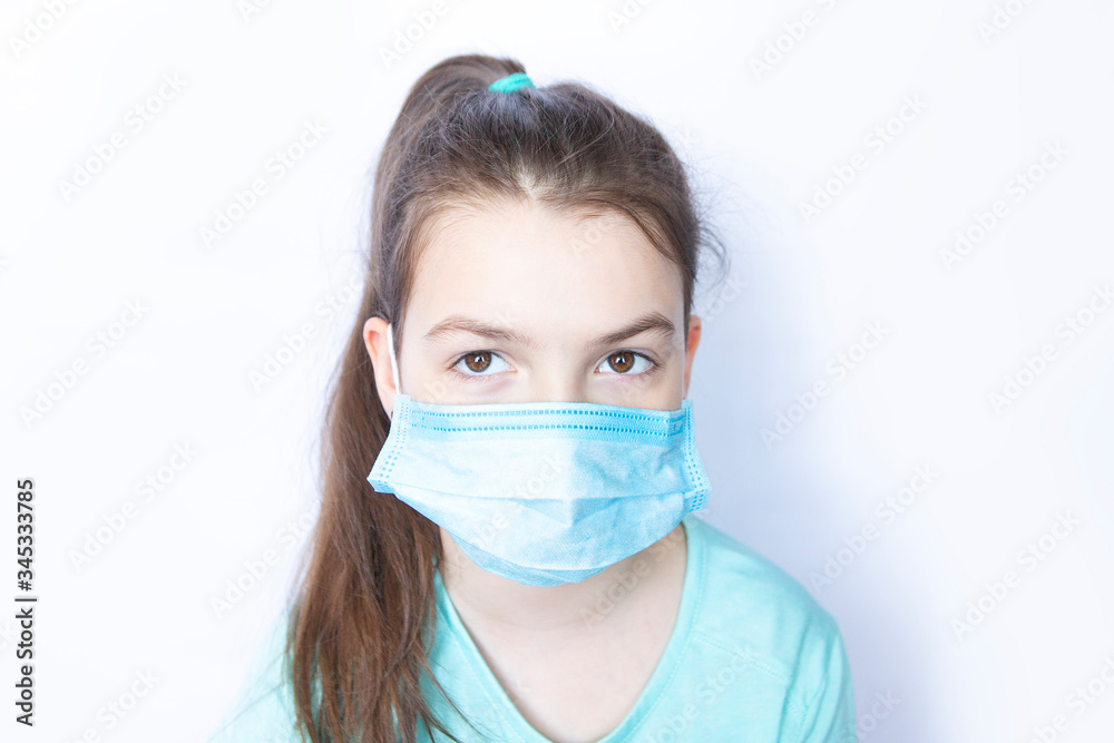 Girl child wearing medical disposable mask on white background Girl child wearing medical disposable mask on white background