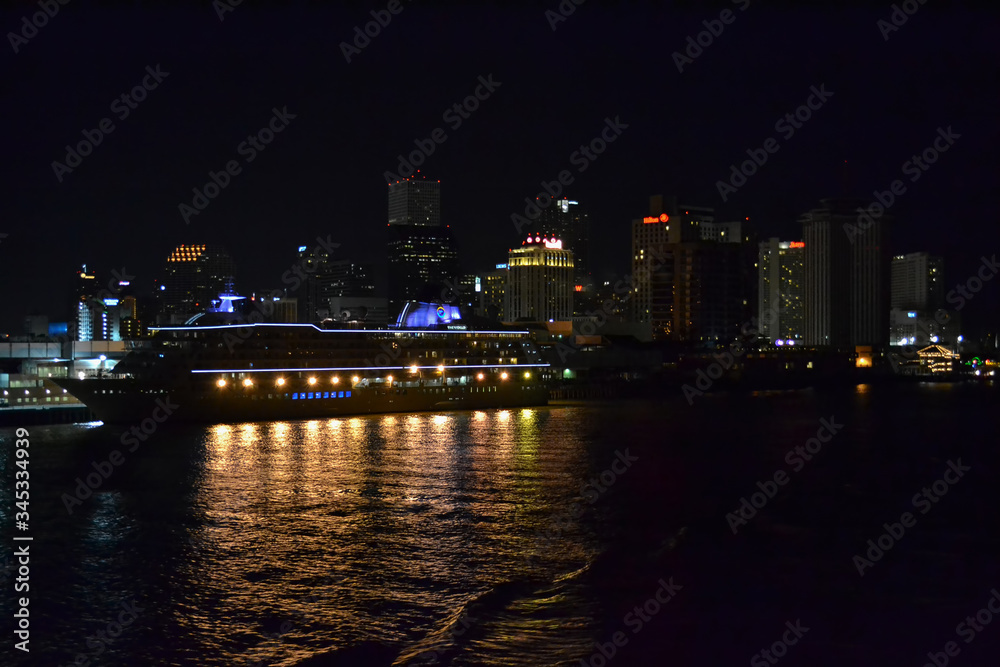 night panorama with cruise ship near town. night light on cruise ship