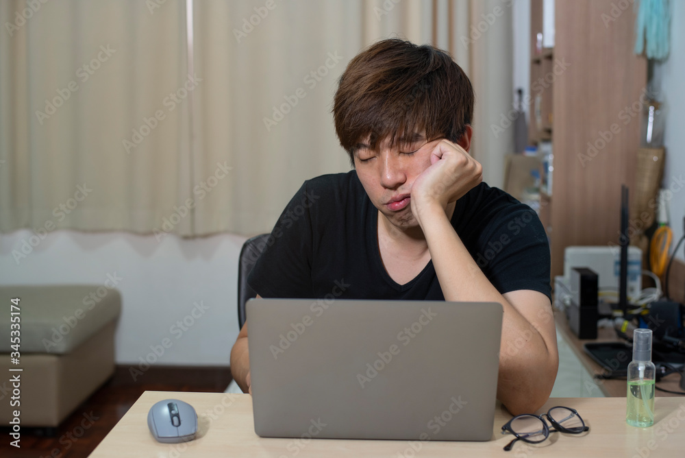 Asian officer man work from home. Man work in action at home. Man with laptop working remotely via high speed internet connection. Communication technology meeting from home. Asian officer man work from home. Man work in action at home. Man with laptop working remotely via high speed internet connection. Communication technology meeting from home.